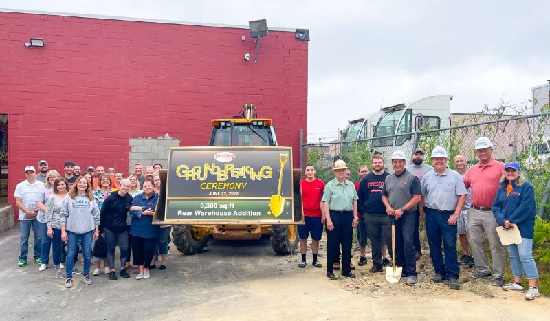 photo of the team celebrating the warehouse addition